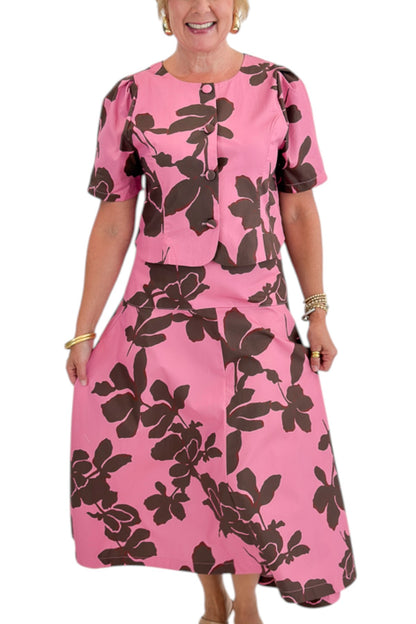 Front detail view of woman wearing Swagger Boutique’s Pink &amp; Brown Floral Midi Skirt &amp; Pink &amp; Brown Floral Button Up Top by Entro against white studio background.
