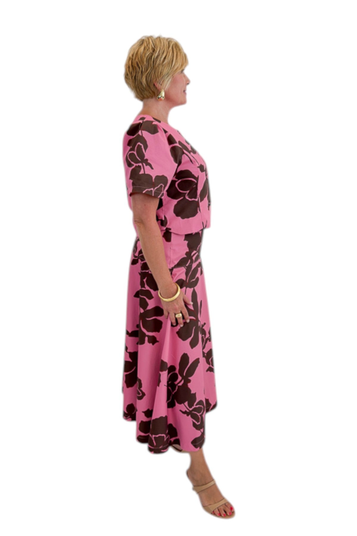 Side view of woman wearing Swagger Boutique’s Pink &amp; Brown Floral Midi Skirt &amp; Pink &amp; Brown Floral Button Up Top by Entro against white studio background.