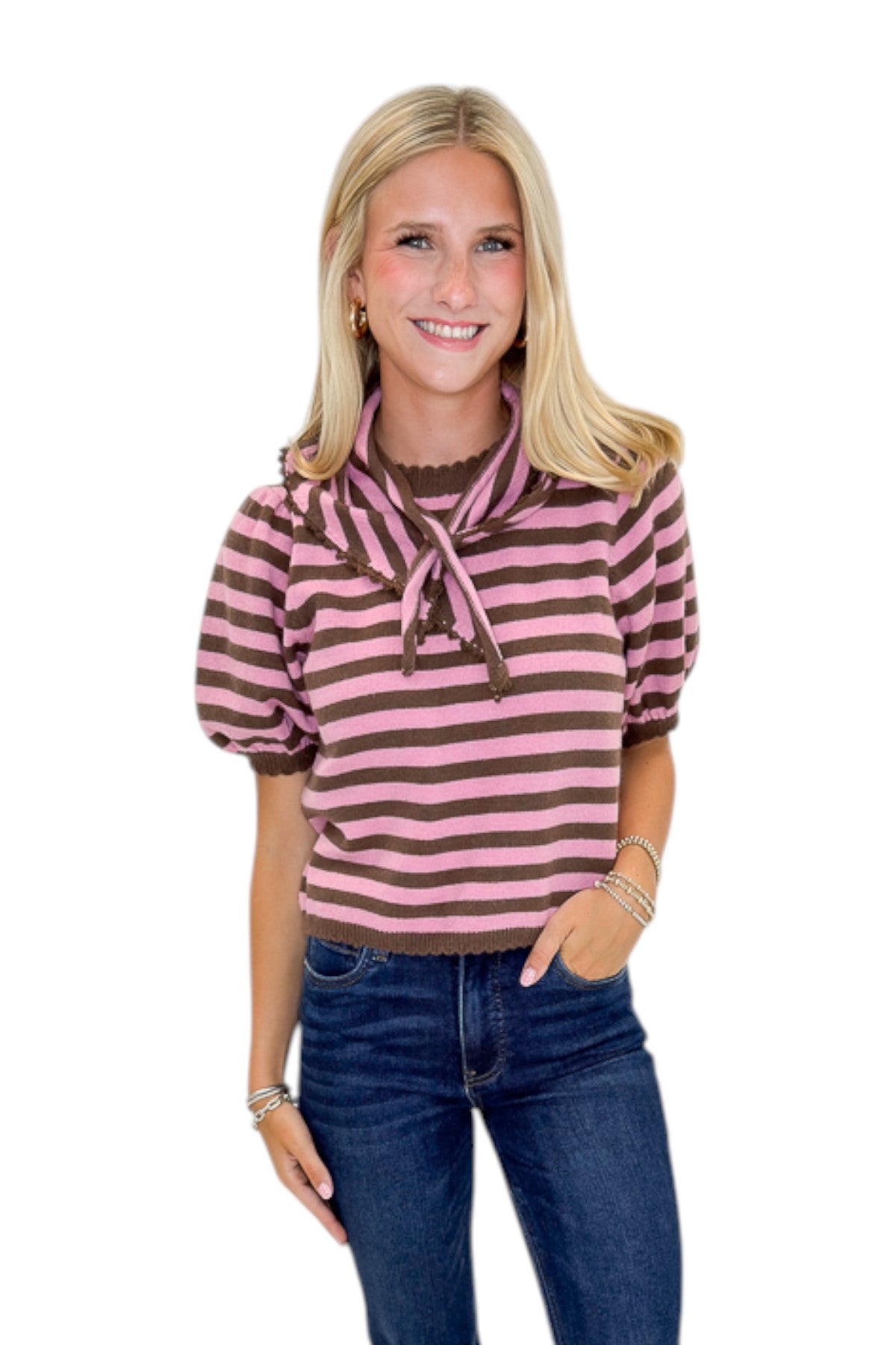 Front view of woman wearing Swagger Boutique’s Pink &amp; Brown Striped Faux Tie Short Sleeve Sweater by Entro with jeans against white studio background.