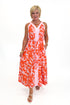 Front view of woman wearing Swagger Boutique’s Pink & Orange Floral Midi Dress by Entro with heels against white studio background.