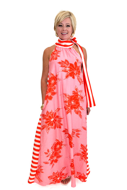 Front view of woman wearing Swagger Boutique’s Pink &amp; Orange Floral &amp; Stripe Maxi Dress by Entro with heels against white studio background.