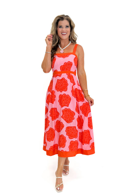 Front view of woman wearing Swagger Boutique’s Pink &amp; Orange Printed Midi Dress by Entro with sandals against white studio background.