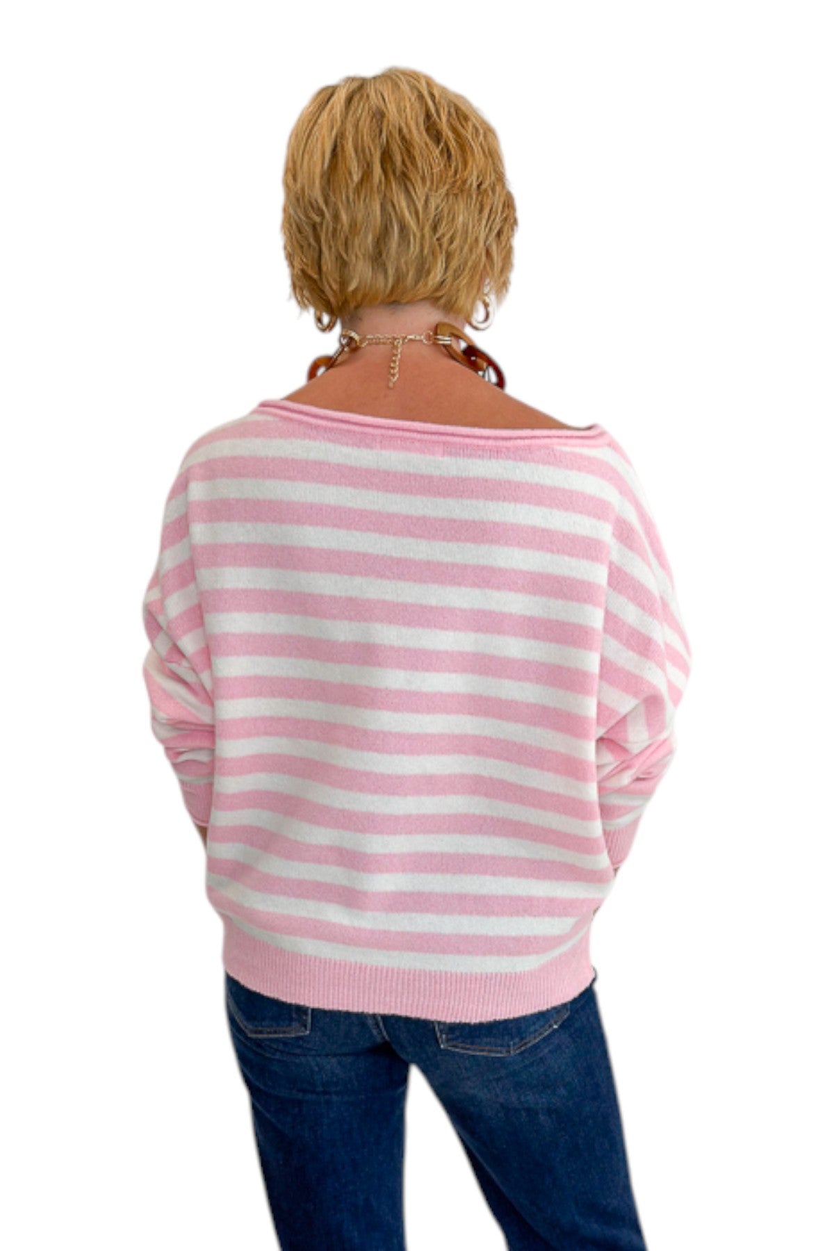 Back view of woman wearing Swagger Boutique’s Pink &amp; White Striped Sweater with jeans against white studio background.