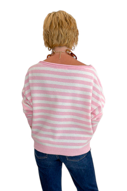 Back view of woman wearing Swagger Boutique’s Pink &amp; White Striped Sweater with jeans against white studio background.