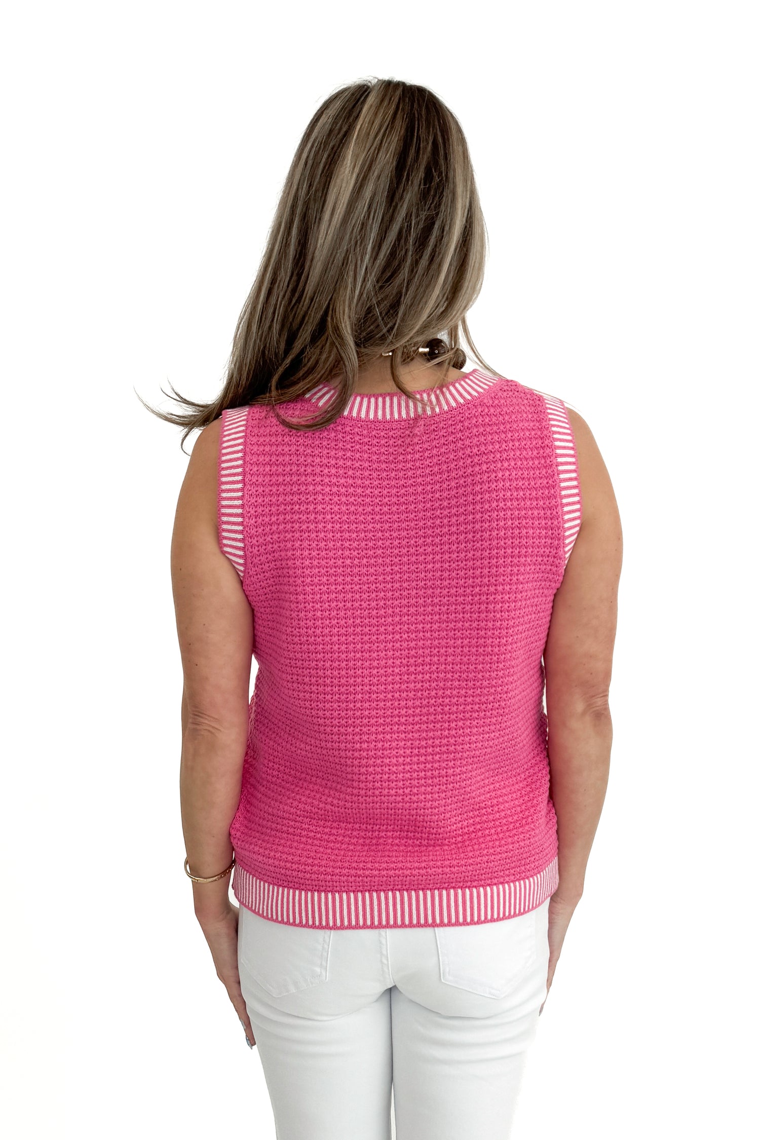 Back view of woman wearing Above All Else Pink &amp; White Textured Sweater Tank with jeans against white studio background.