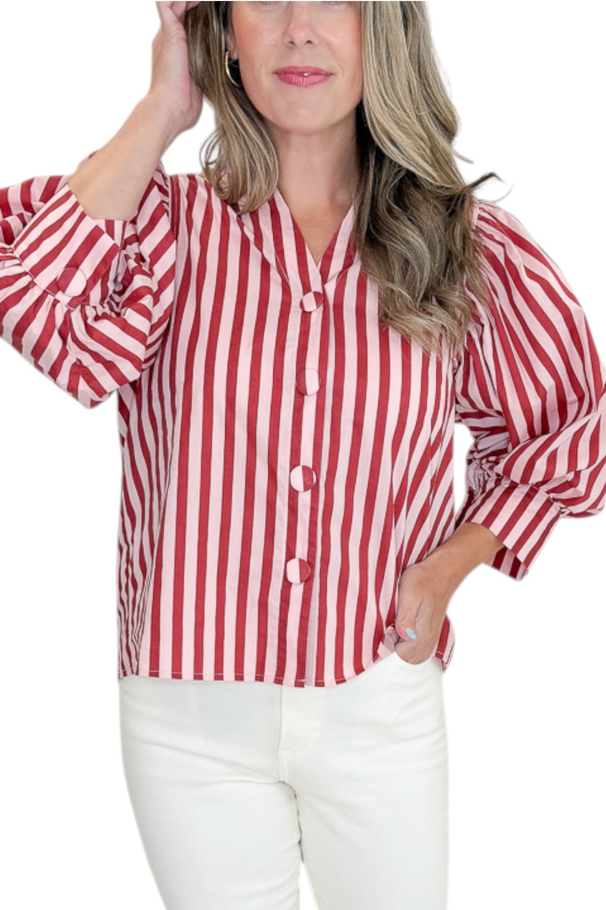 Front detail view of woman wearing Swagger Boutique’s Pink &amp; Wine Striped Puff Sleeve Top with jeans against white studio background.