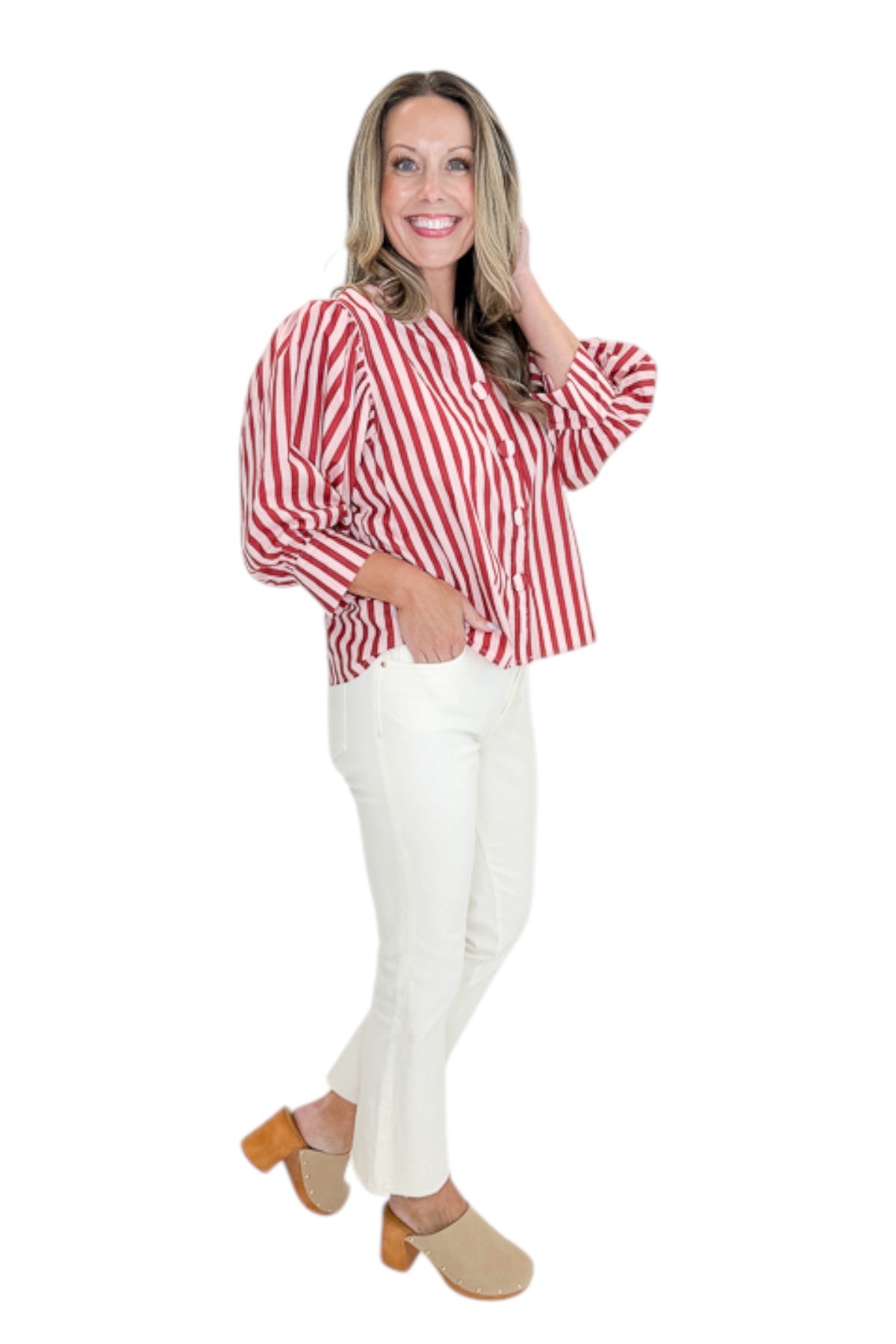 Side view of woman wearing Swagger Boutique’s Pink &amp; Wine Striped Puff Sleeve Top with jeans against white studio background.