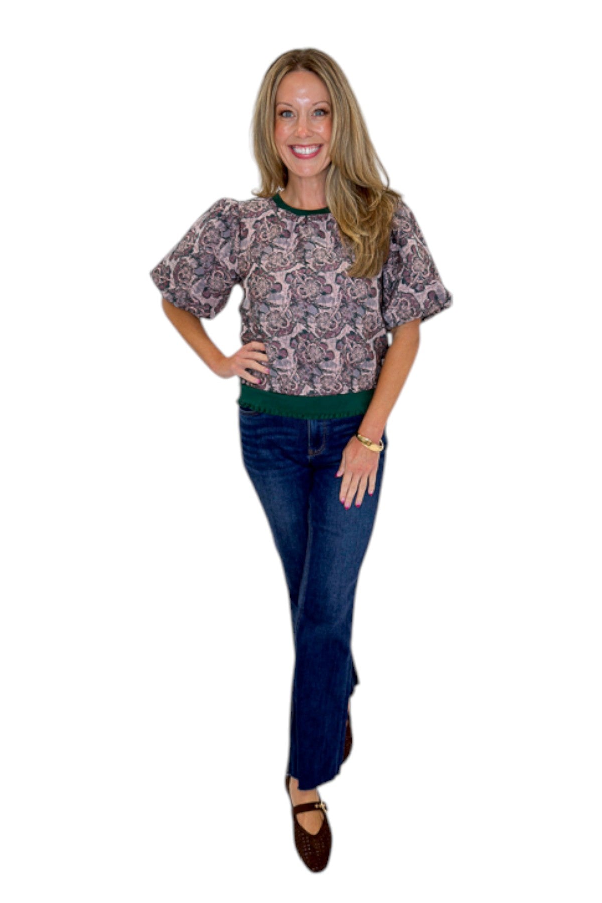 Front view of woman wearing Swagger Boutique’s Plum Jacquard Bubble Sleeve Top with jeans against white studio background.