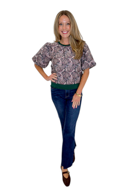 Front view of woman wearing Swagger Boutique’s Plum Jacquard Bubble Sleeve Top with jeans against white studio background.