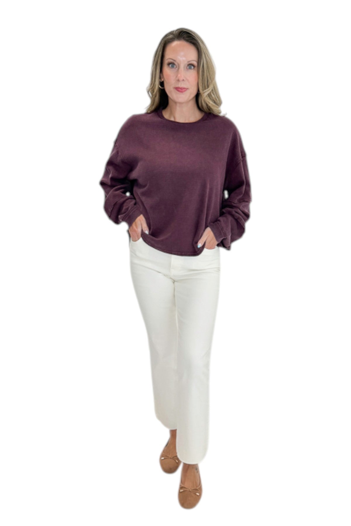 Front view of woman wearing Swagger Boutique’s Plum Textured Sweatshirt with jeans against white studio background.