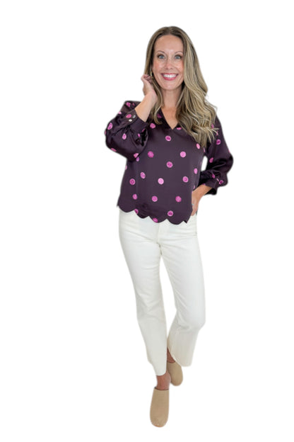 Front view of woman wearing Swagger Boutique’s Plum &amp; Pink Polka Dot 3/4 Sleeve Top by Entro with jeans against white studio background.