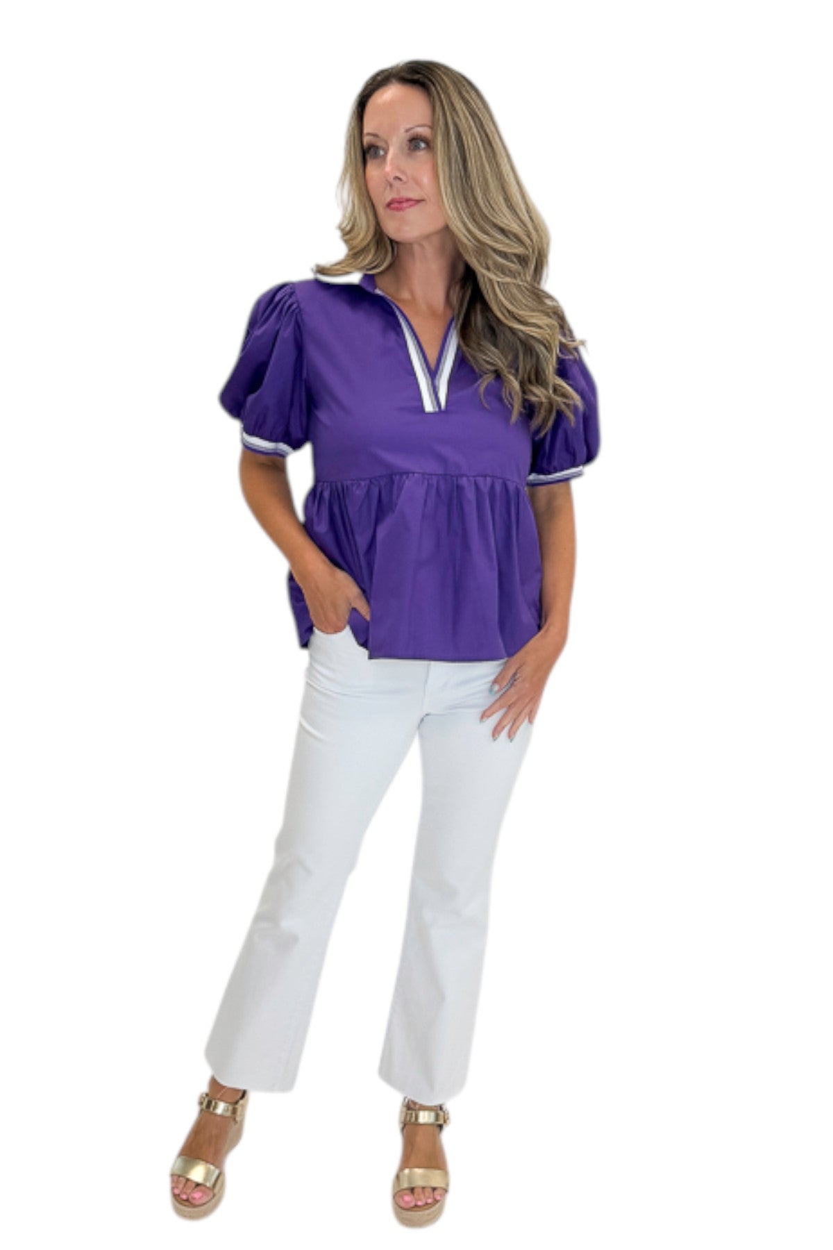 Front view of woman wearing Swagger Boutique’s Purple Collared Peplum Top with jeans against white studio background.