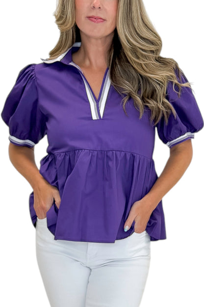 Front detail view of woman wearing Swagger Boutique’s Purple Collared Peplum Top with jeans against white studio background.