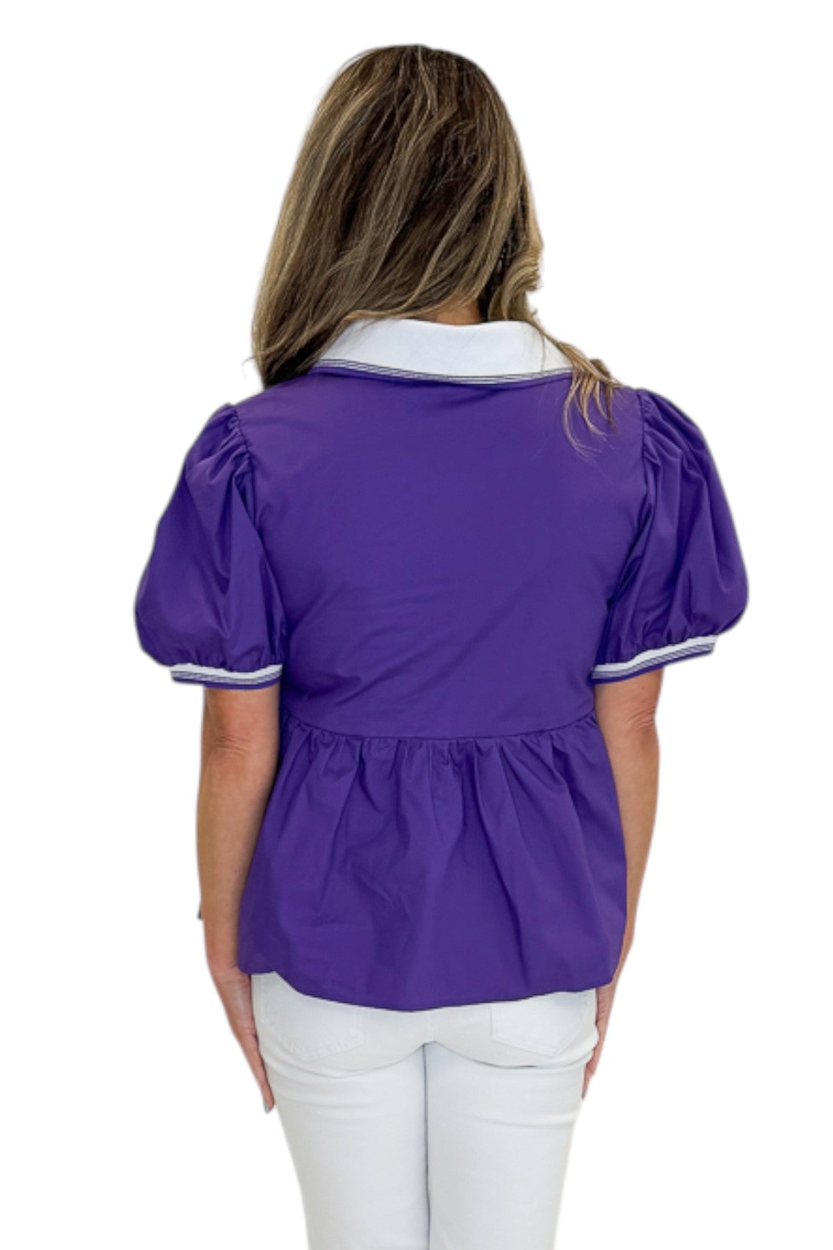 Back view of woman wearing Swagger Boutique’s Purple Collared Peplum Top with jeans against white studio background.