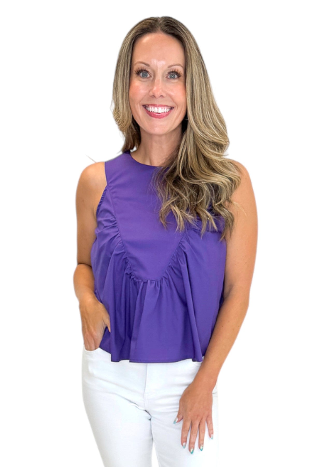 Front view of woman wearing Swagger Boutique’s Purple Ruffle Tank with jeans against white studio background.