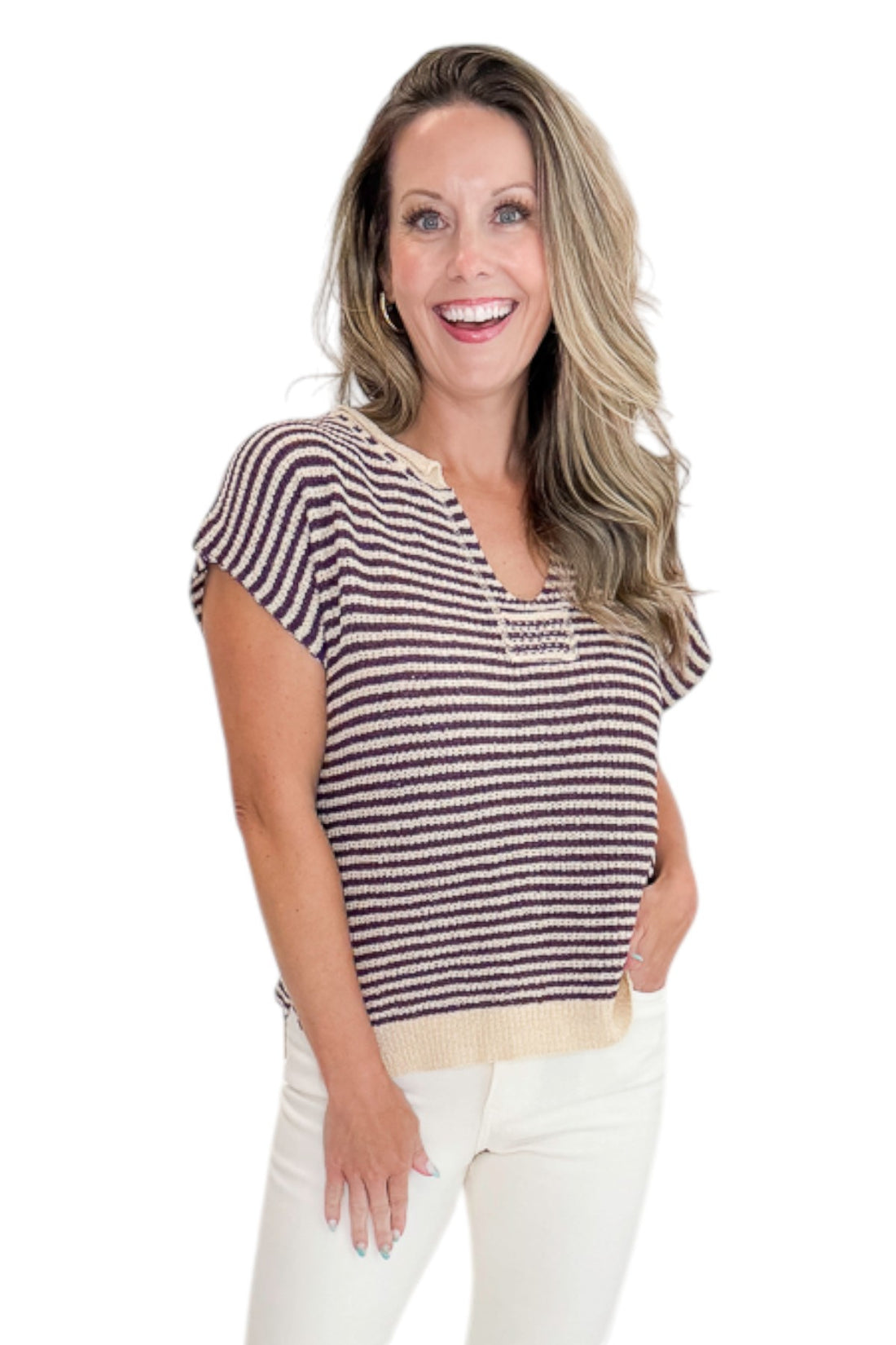 Front view of woman wearing Swagger Boutique’s Purple &amp; Beige Striped Sleeveless Sweater with jeans against white studio background.
