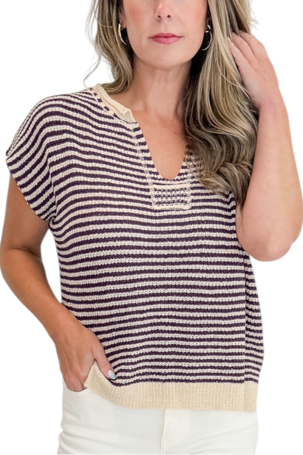 Front detail view of woman wearing Swagger Boutique’s Purple &amp; Beige Striped Sleeveless Sweater with jeans against white studio background.