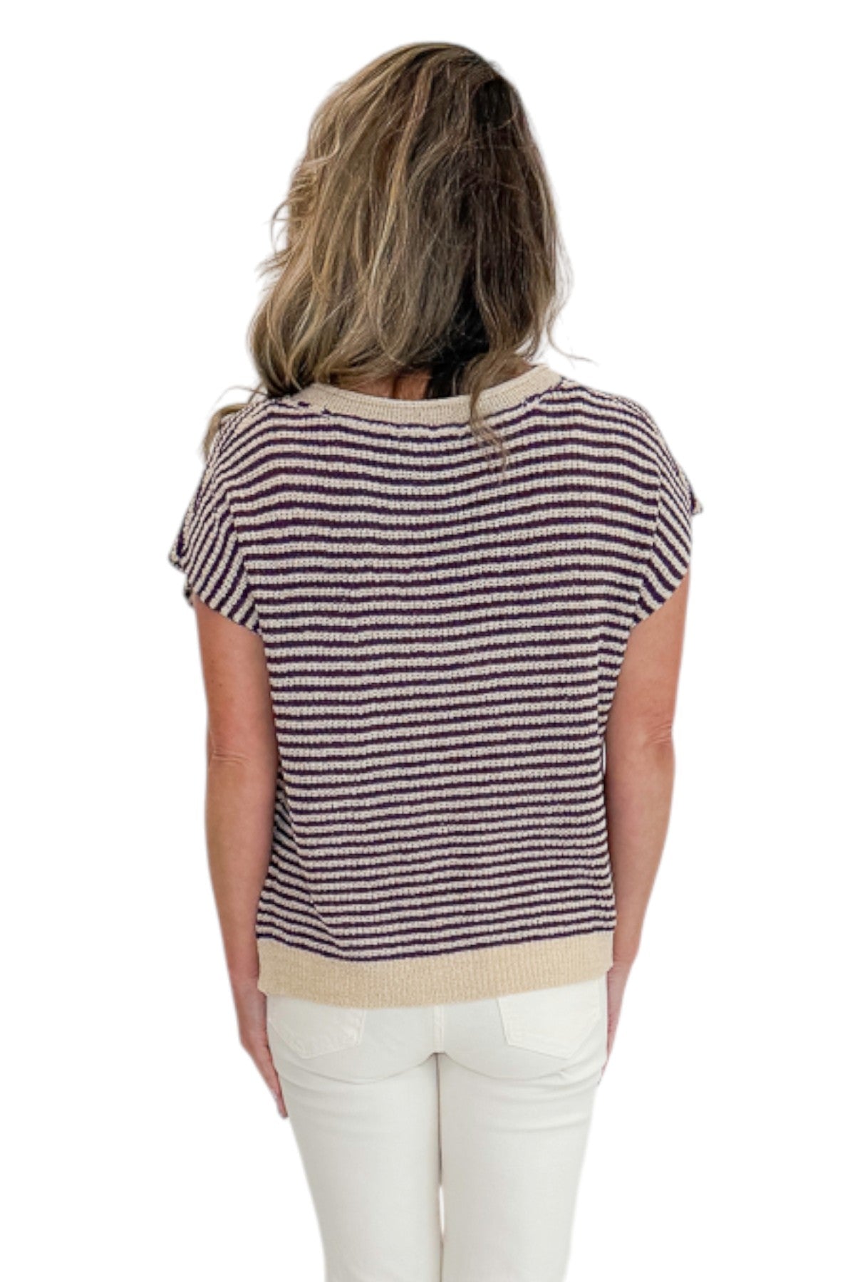 Back view of woman wearing Swagger Boutique’s Purple &amp; Beige Striped Sleeveless Sweater with jeans against white studio background.