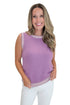 Front view of woman wearing Swagger Boutique’s Purple & White Textured Sweater Tank with jeans against white studio background.