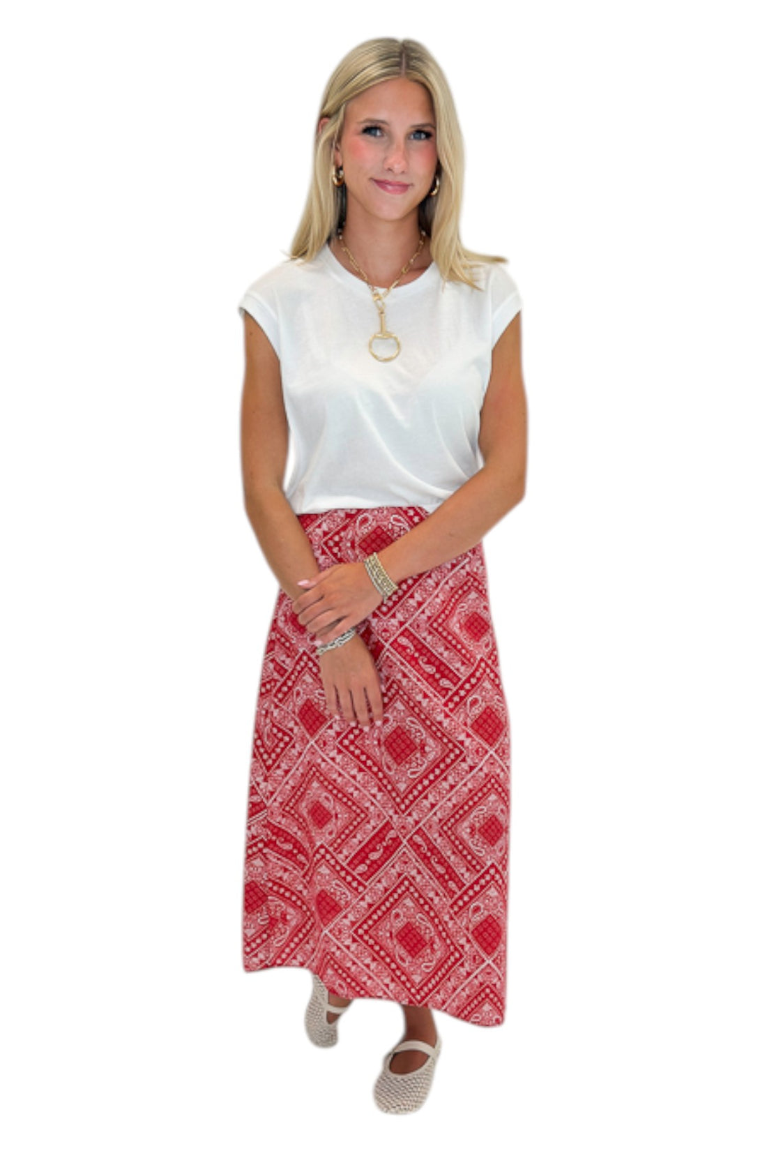 Front view of woman wearing Swagger Boutique’s Red Bandana Print Midi Skirt with white top against white studio background.