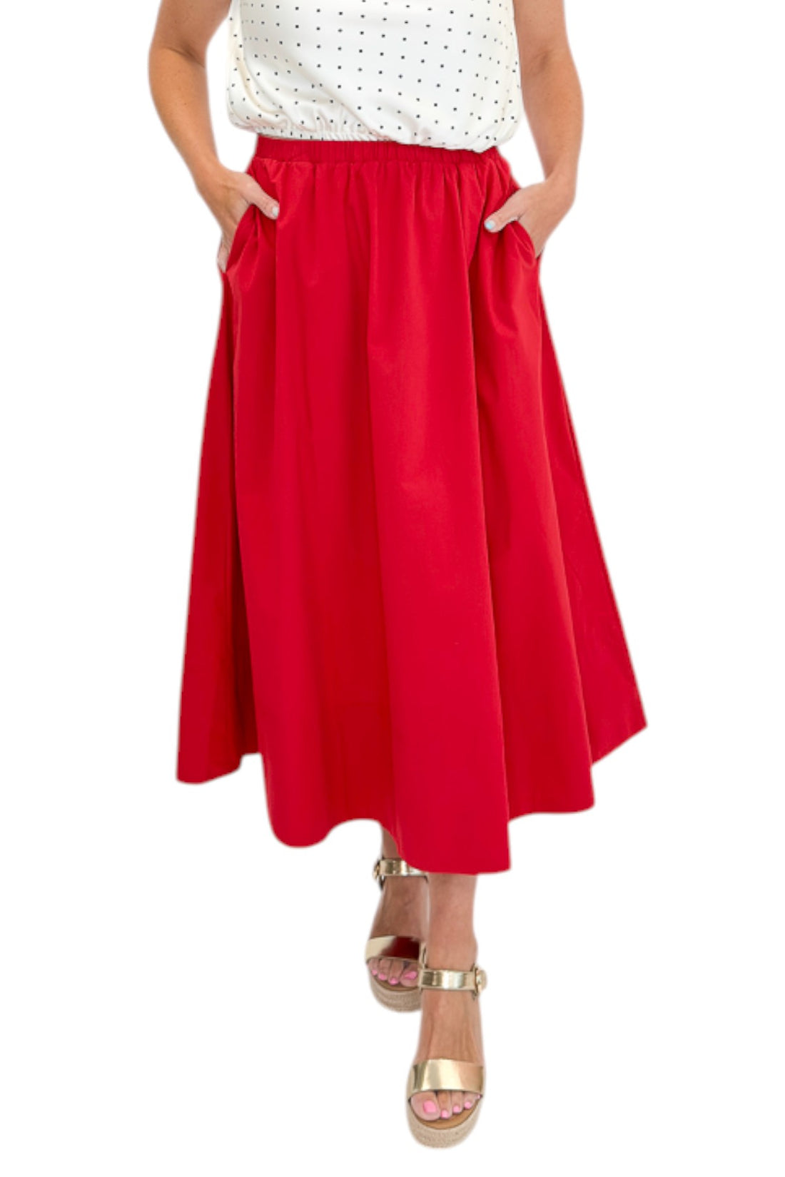 Front view of woman wearing Swagger Boutique’s Red Elastic Waist Midi Skirt with sandals against white studio background.