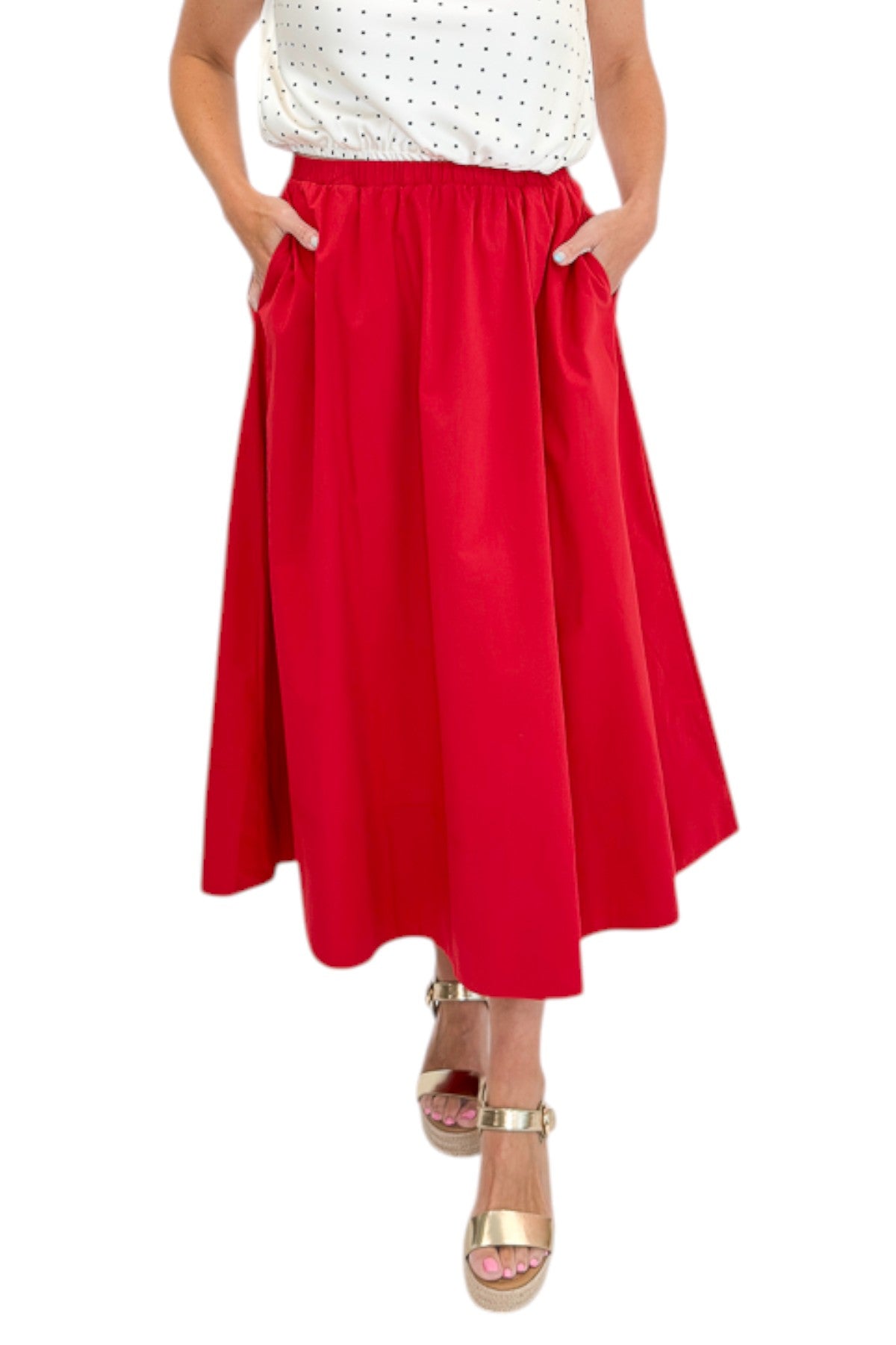 Front view of woman wearing Swagger Boutique’s Red Elastic Waist Midi Skirt with sandals against white studio background.