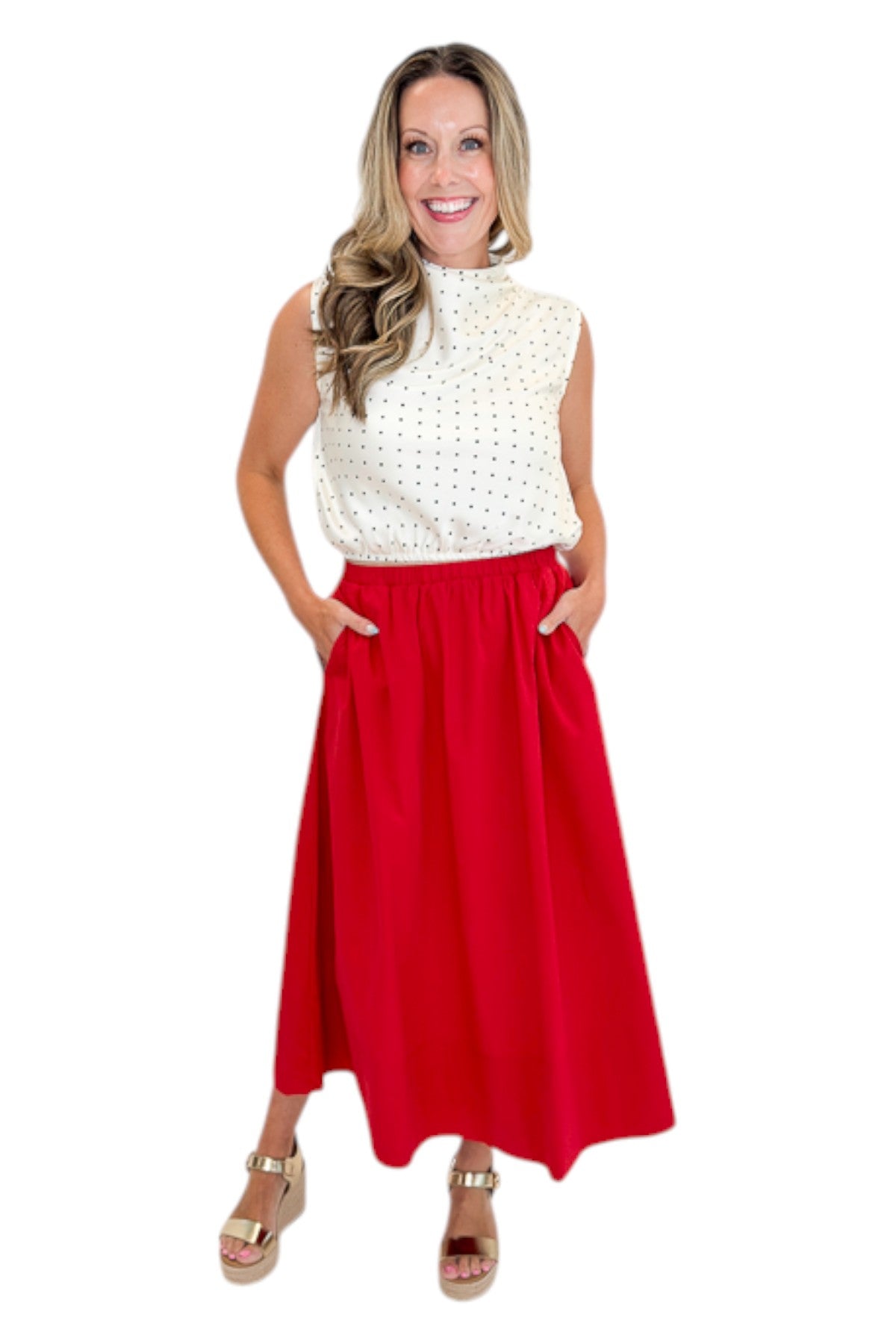 Front view of woman wearing Swagger Boutique’s Red Elastic Waist Midi Skirt with sandals against white studio background.