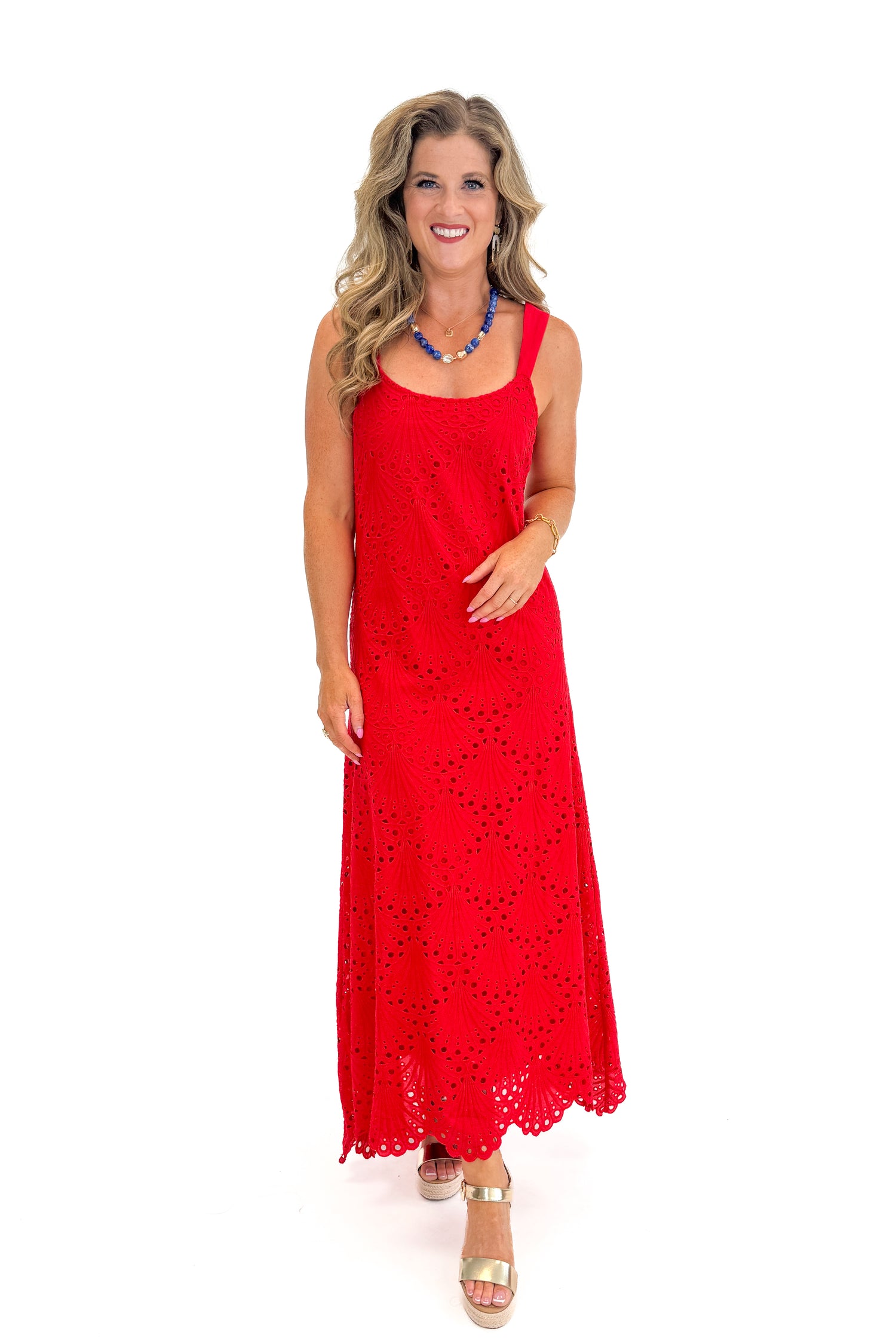 Front view of woman wearing Swagger Boutique’s Red Embroidered Maxi Dress with sandals against white studio background.