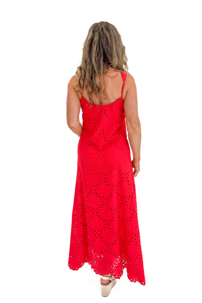 Back view of woman wearing Swagger Boutique’s Red Embroidered Maxi Dress with sandals against white studio background.