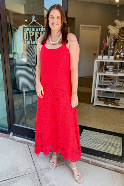 Front view of woman wearing Swagger Boutique’s Red Embroidered Maxi Dress with sandals standing outside.