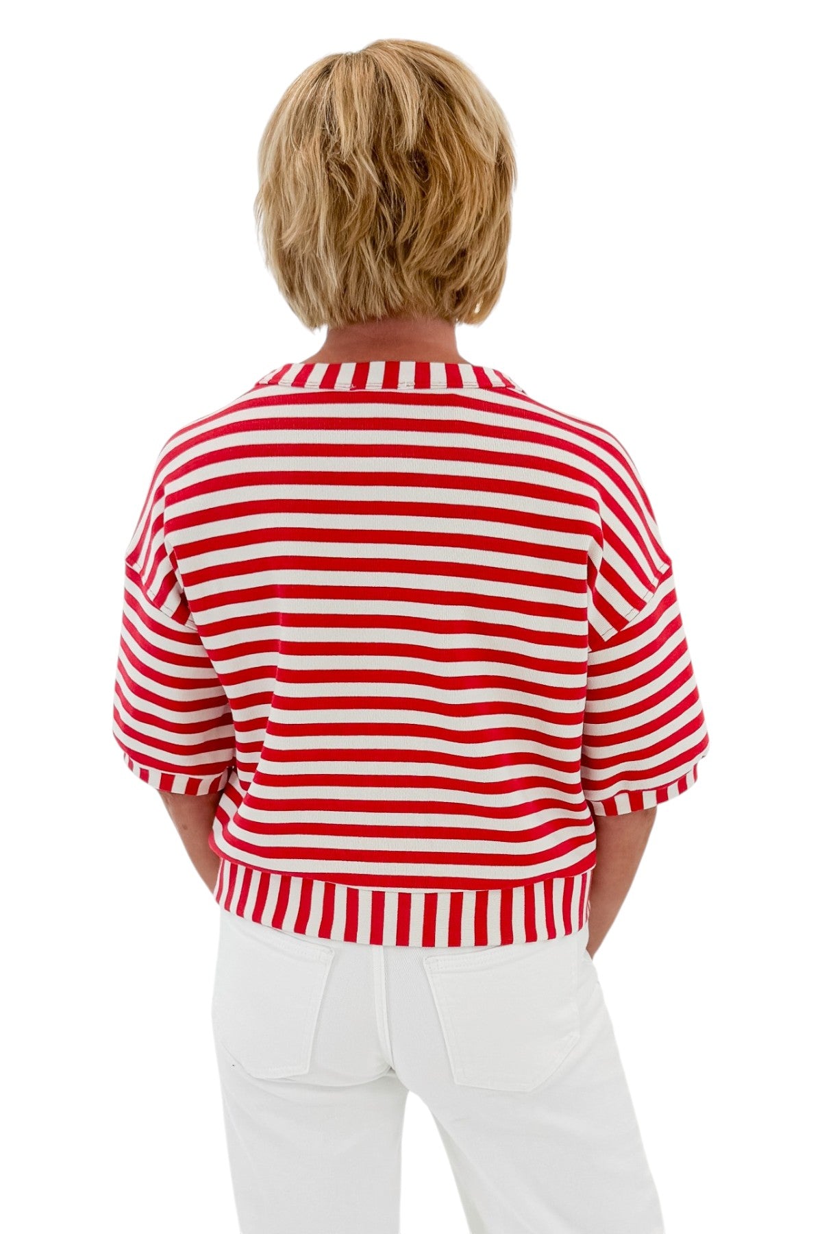 Back view of woman wearing Swagger Boutique’s Red Striped Short Sleeve Button Up Top with jeans against white studio background.