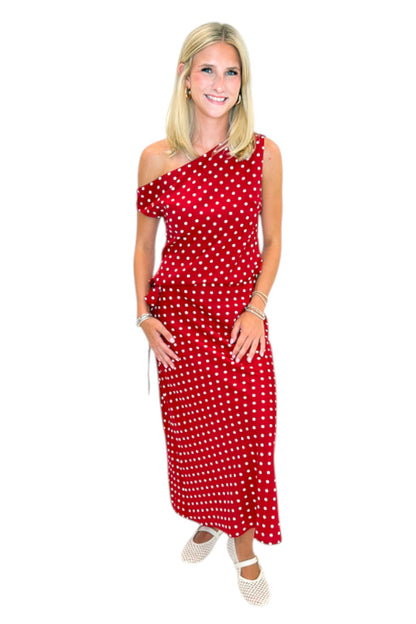 Front view of woman wearing Swagger Boutique’s Red &amp; White Polka Dot Midi Skirt with Red &amp; White Polka Dot Asymmetrical Tank against white studio background.