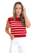 Front view of woman wearing Swagger Boutique’s Red & White Striped Sleeveless Sweater with jeans against white studio background.