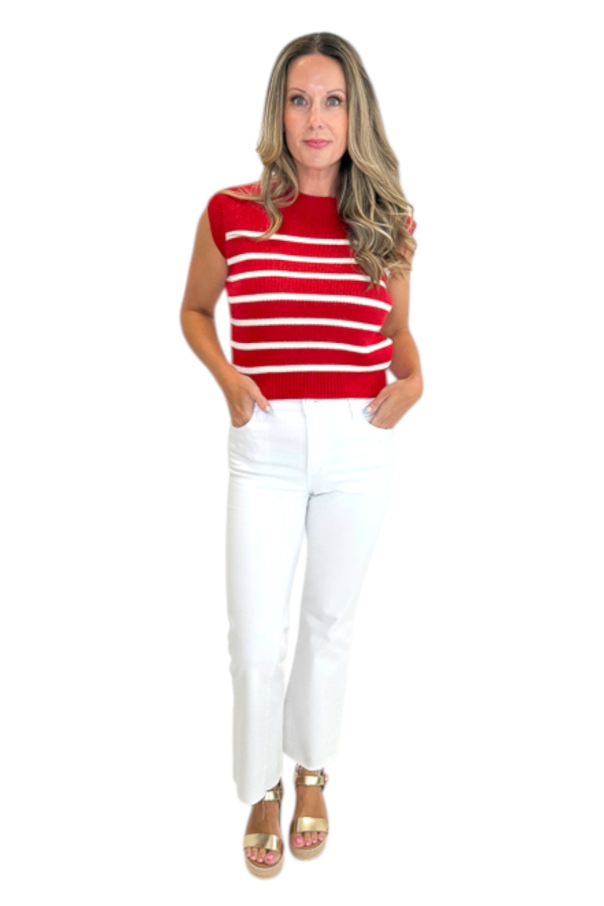 Front view of woman wearing Swagger Boutique’s Red &amp; White Striped Sleeveless Sweater with jeans against white studio background.