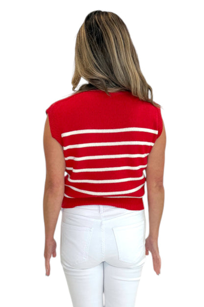 Back view of woman wearing Swagger Boutique’s Red &amp; White Striped Sleeveless Sweater with jeans against white studio background.