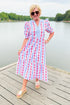 Front view of woman wearing Swagger Boutique’s Red, White & Blue Jonah Midi Dress by MudPie with Lulah Platform Sandals and sunglasses outside at the lake.