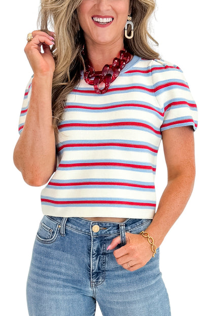 Front detail view of woman wearing Swagger Boutique’s Red, White &amp; Blue Striped Top by Entro with jeans against white studio background.