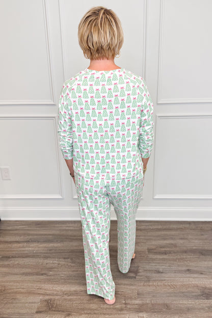 Back view of the Rosy Woodlands Annie Pajama Set, showcasing the festive green Christmas tree and pink bow print. The long-sleeve crewneck top features a comfortable, relaxed silhouette paired with matching full-length pajama pants.