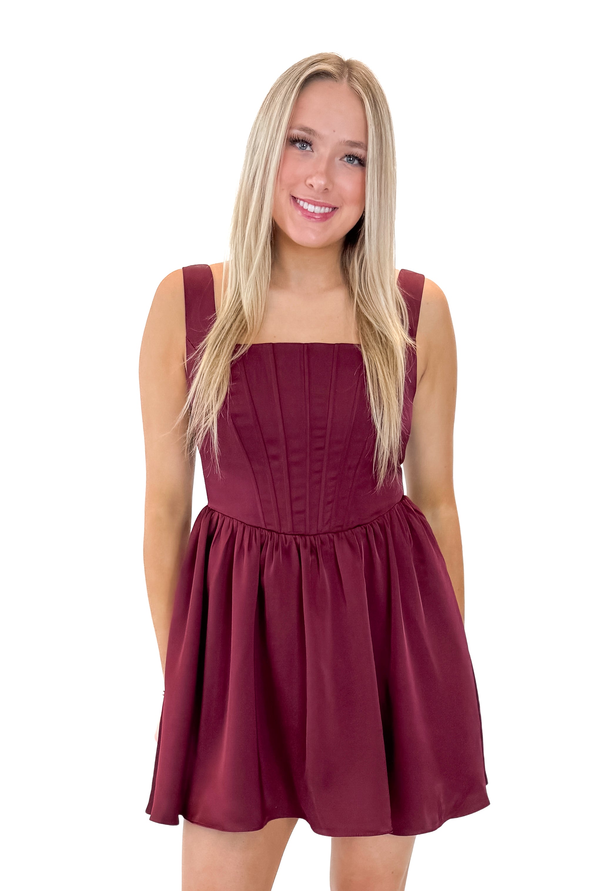 Front view of woman wearing Wine Corset Detail Satin Dress with heels against white studio background.