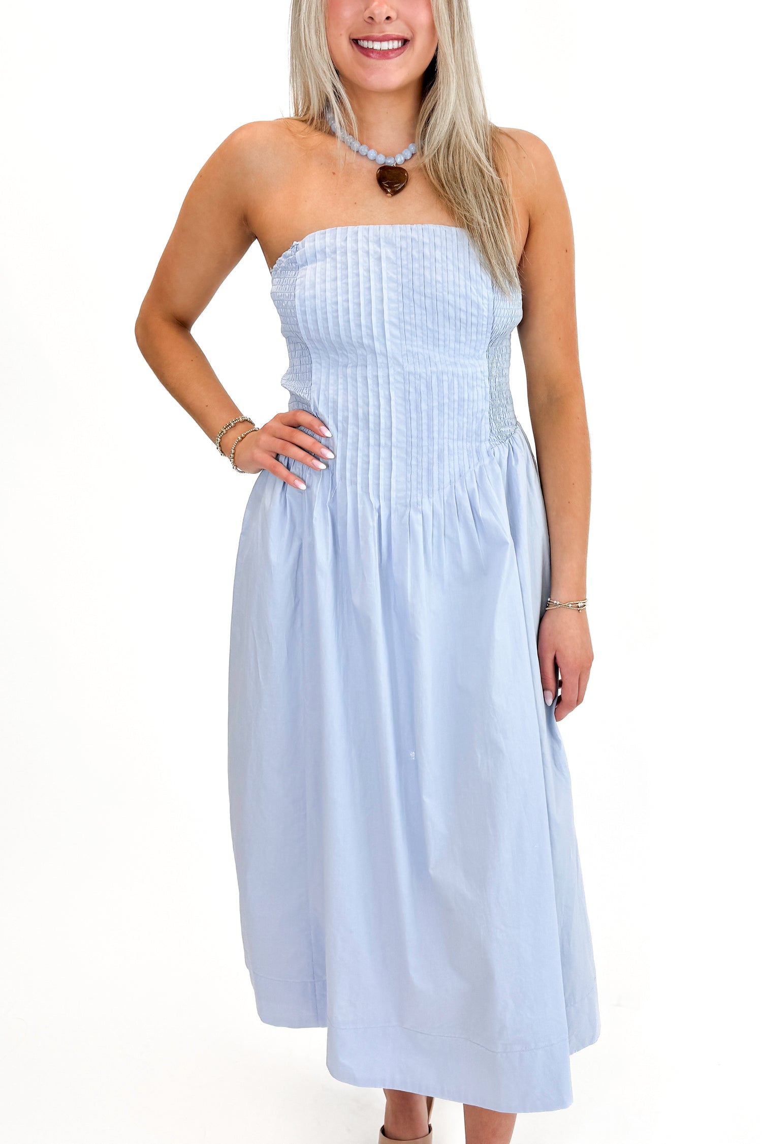 Front view of woman wearing Light Blue Pintucked Detail Midi Dress against white studio background.