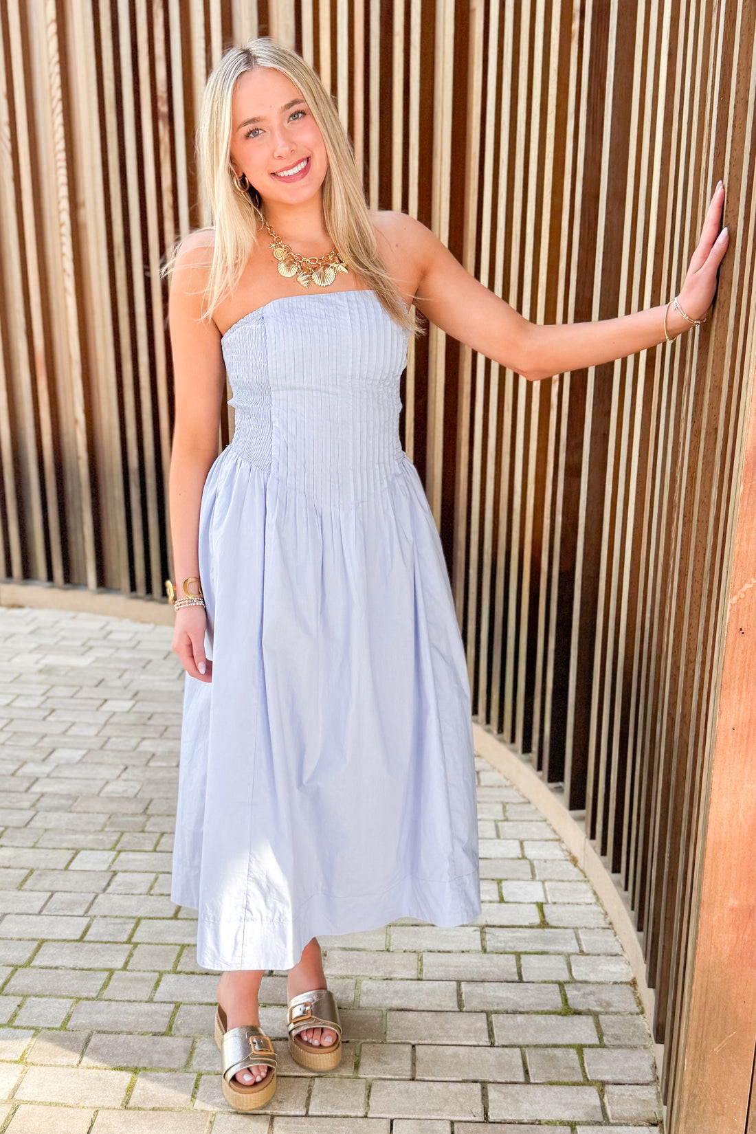 Front view of woman wearing Light Blue Pintucked Detail Midi Dress outside at a park.