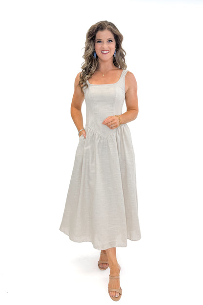 Front view of woman wearing Taupe Striped V-Waist Dress against white studio background.