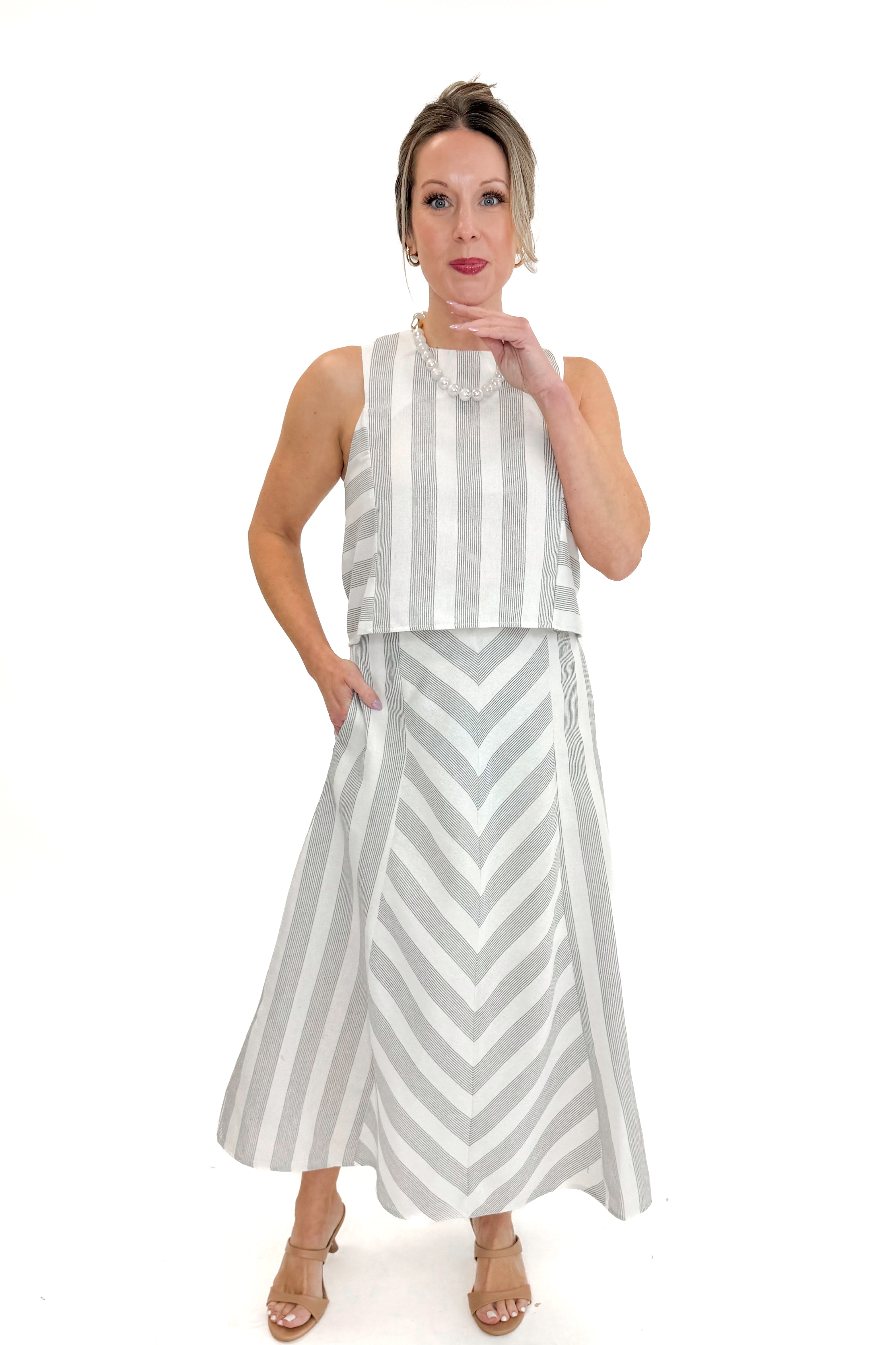 Front view of woman wearing Cream &amp; Grey Striped Skirt by Entro with matching tank against white studio background.