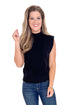 Woman wearing a black sleeveless top and blue jeans on a white background