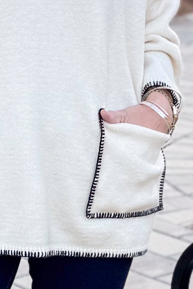 Front view of woman wearing Cream Pocket &amp; Stitch Detail Sweater with jeans outside.