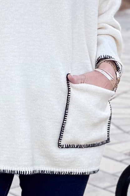 Front view of woman wearing Cream Pocket &amp; Stitch Detail Sweater with jeans outside.