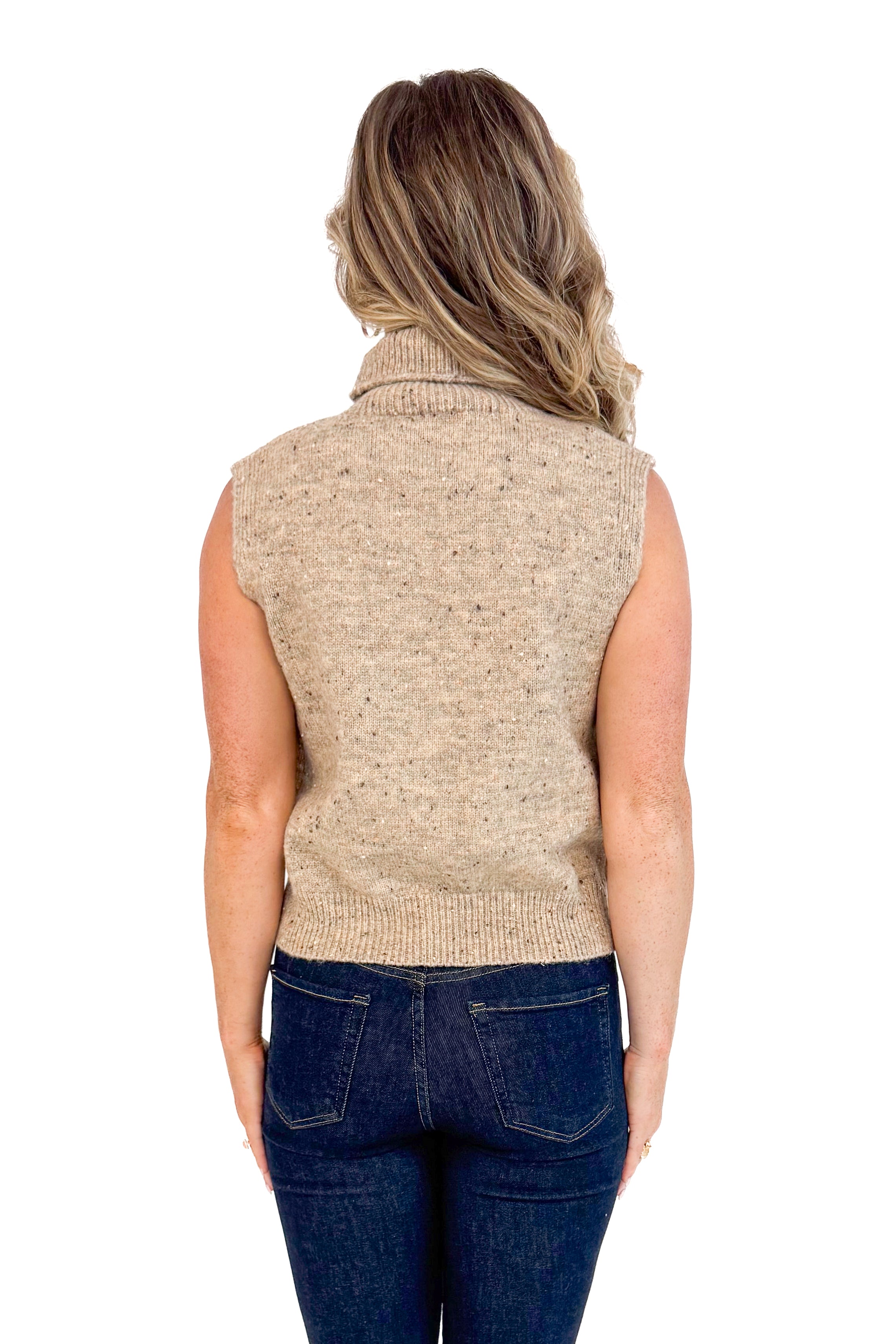 Woman wearing Sweeter Than Cider Taupe Turtleneck Sleeveless Sweater by She + Sky - back view showing turtleneck design and sleeveless cut