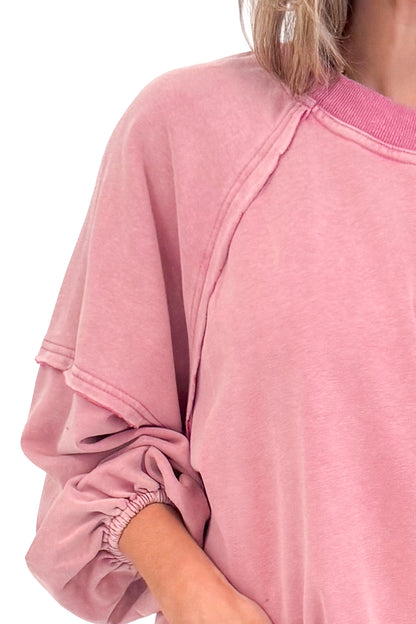 Detailed view of woman wearing Washed Mauve Puff Sleeve Sweatshirt by She + Sky.