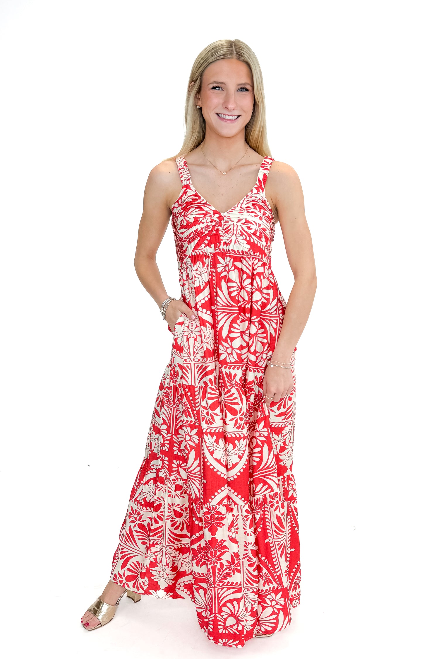 Front view of woman wearing Red Printed Sleeveless V-neck Maxi Dress against white studio background.
