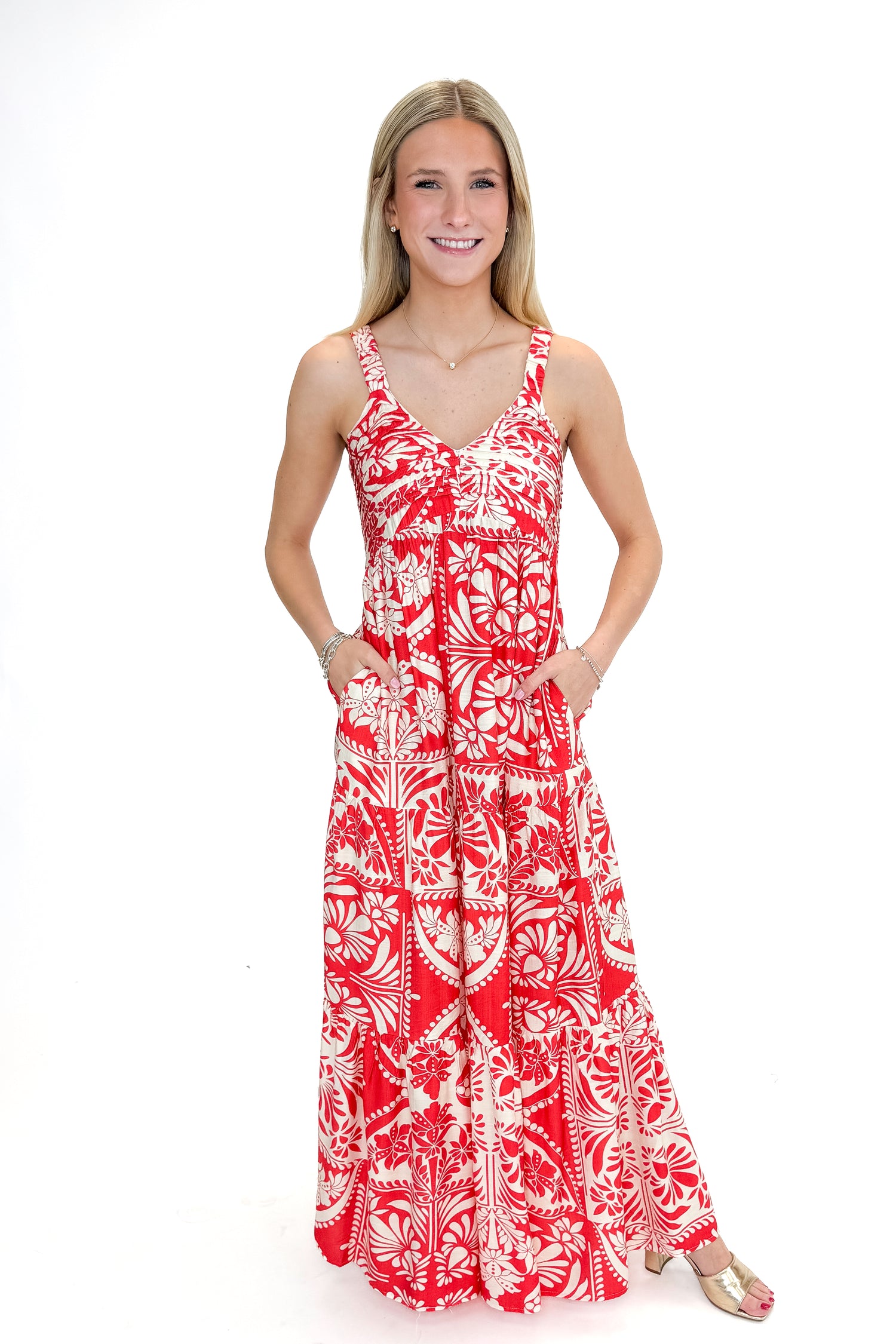 Front view of woman wearing Red Printed Sleeveless V-neck Maxi Dress against white studio background.